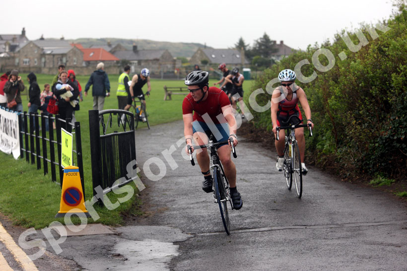 Start of the cycling during the Bamburgh Triathlon as the rain starts